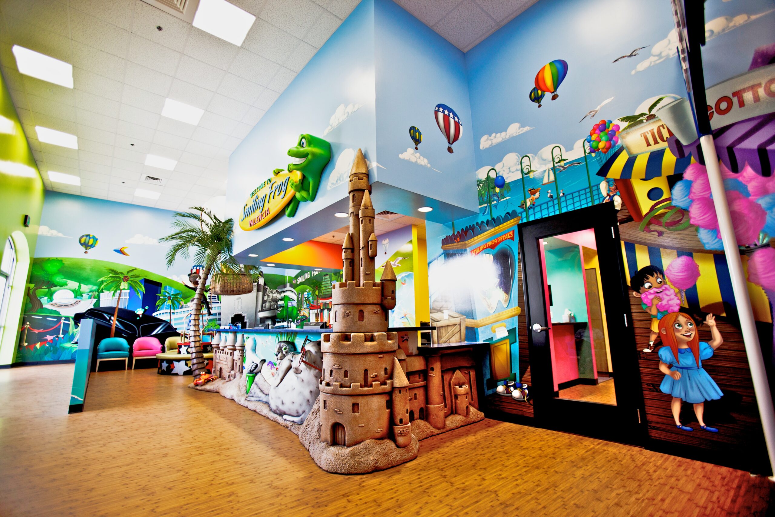 A children's playroom with colorful murals.
