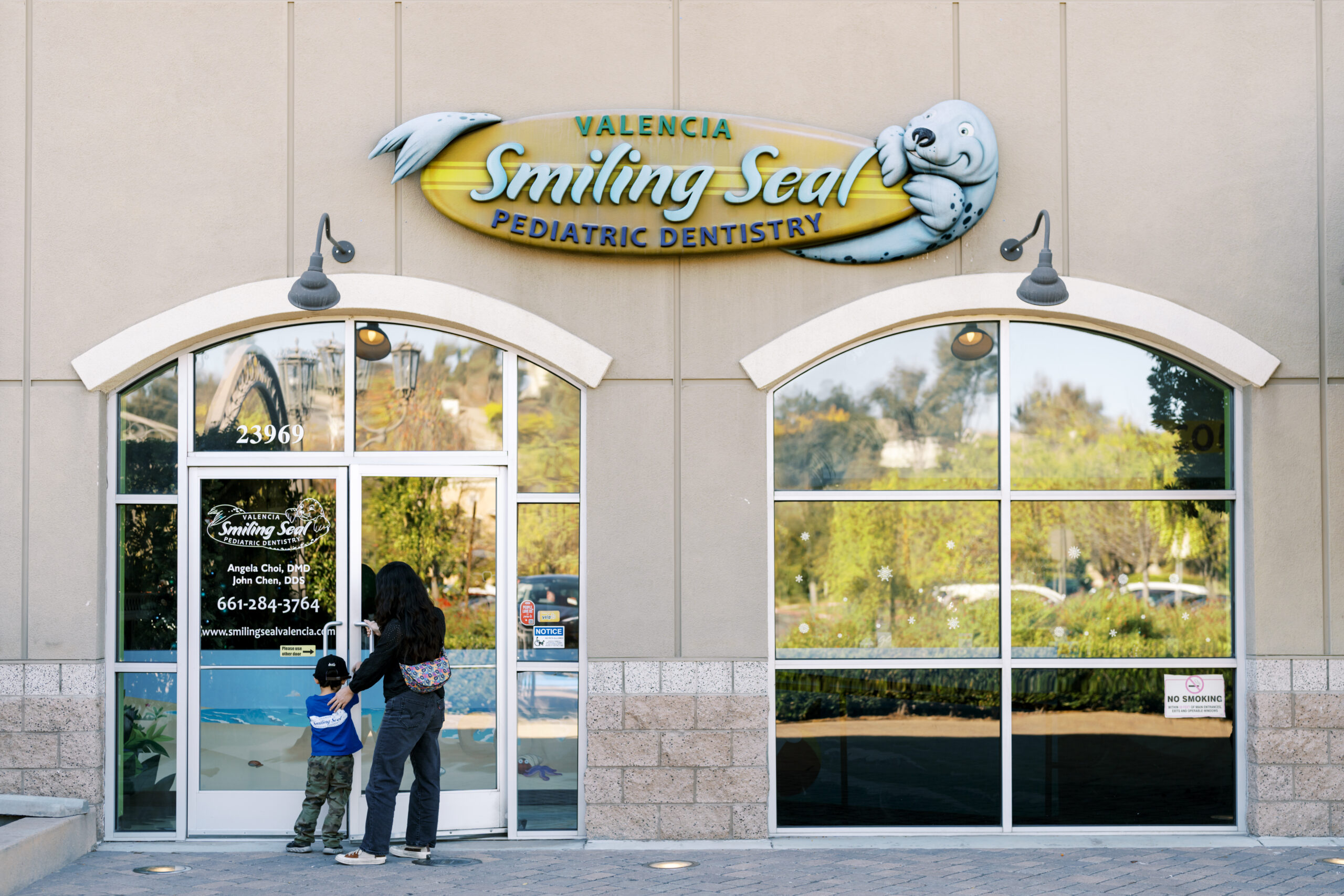 A dentist's office with a shark on the wall.